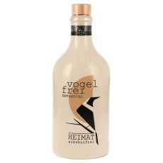 Heimat Vogelfrei Botanical alkoholfrei 0,5l. Hellbeige Keramikflasche mit schwarzer vogelfrei Botanical und Heimat Aufschrift sowie schwarz-weiße Vogelabbildung.