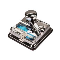 OCB Stopfmaschine Mikr O Matic Duo. Silbernes Gerät mit blauem Warnhinweis und Mikro O Matic Aufschrift.