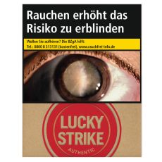 Schachtel Zigaretten Lucky Strike Authentic Rot. Beige Packung mit rotem Lucky Strike Logo und Auge.