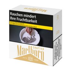 Schachtel Zigaretten Marlboro Crafted Gold. Gold-weiße Packung Crafted Aufschrift mit Warnhinweis Aschenbecher.