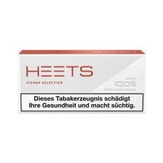 Packung Tabaksticks IQOS HEETS Sienna Selection 20 Stück. Graue Packung mit rotem Heets Logo.