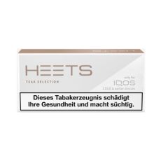 Schachtel Tabaksticks IQOS HEETS Teak Selection 20 Stück. Graue Packung mit beigem HEETS Logo. 