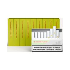 Stange Tabaksticks IQOS HEETS Yellow Green Selection 200 Stück. Zehn grüne Packungen mit Tabaksticks im Vordergrund.
