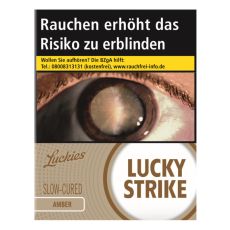 Schachtel Zigaretten Lucky Strike Amber XXL 24 Stück. Goldenen Packung mit weißem Lucky Strike Logo und Auge.