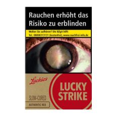 Schachtel Zigaretten Lucky Strike Authentic Rot. Beige Packung mit rotem Lucky Strike Logo und Auge.
