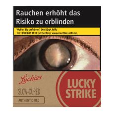 Schachtel Zigaretten Lucky Strike Authentic Rot. Beige Packung mit rotem Lucky Strike Logo und Auge.